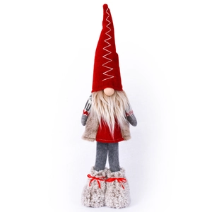 Nordic Christmas gnome with red pointed hat and long beard standing on white background