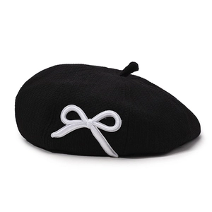 Elegant black beret for women with a delicate white bow embroidery for a chic French style