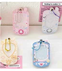 Flat lay of colorful acrylic phone-shaped card holders with cute animal illustrations