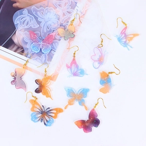 Moule en silicone papillon pour bijoux en résine époxy avec boucles d'oreilles colorées