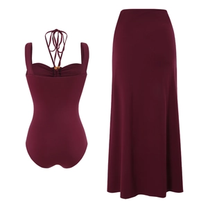 Detail of burgundy boho swimsuit with beaded halter neckline and matching maxi skirt set