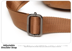 Detailed shot of the brown woven strap and gunmetal gray adjustable buckle of the backpack