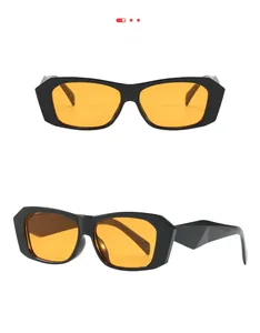 Detail of geometric sunglasses with thick black frame and 3D textured temples