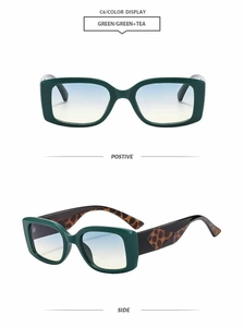 Detail view of square frame sunglasses in dark green finish with gradient tea lenses