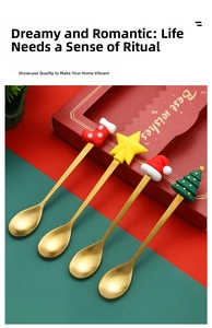 Close-up of golden Christmas spoons set with festive silicone charms in a red gift box