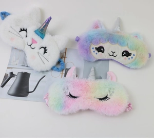 Detail of plush animal unicorn sleep masks with colorful faux fur and cute embroidery