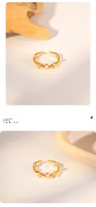 Detail of French vintage gold-plated wavy ring set with elegant white pearls