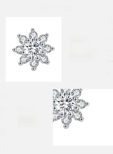 Close-up of 925 sterling silver snowflake earrings with D-color VVS1 moissanite stones
