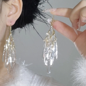 Elegant gold fringe earrings with layered clear acrylic water drop pendants and crystals