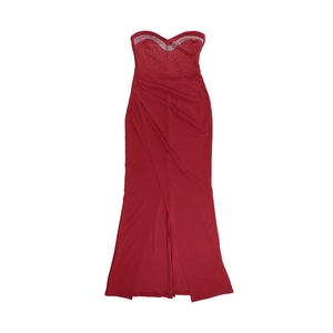 Detail of red strapless evening dress showing rhinestone bust and high slit satin skirt