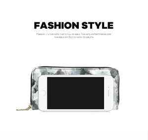 Detail view of long marble pattern wallet with gold zipper and size comparison to a smartphone