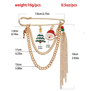 Detailed view of gold Christmas tree and reindeer brooch with chain and size measurements