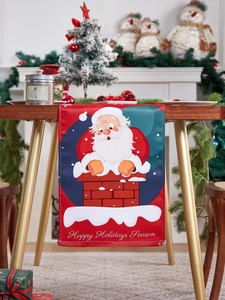 Detail of red Christmas table runner featuring Santa Claus and Happy Holidays greeting