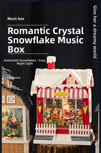 Close-up of Santa's Workshop music box with automatic snow feature and warm LED lights