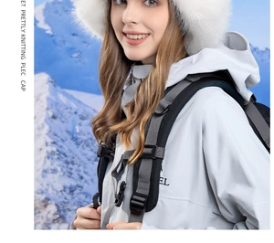 Detail of white faux fur winter usanka hat with ear flaps on snow mountain background