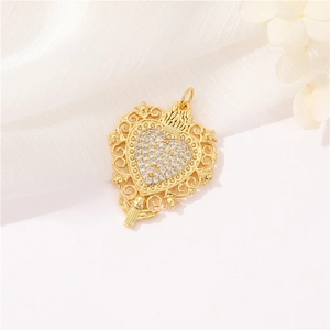 Macro shot of gold zircon sacred heart pendant with wings on soft white fabric
