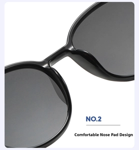 Close-up of the comfortable integrated nose pads on round oversized black sunglasses