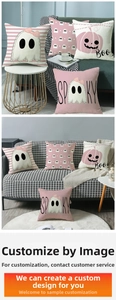Detailed view of Halloween ghost themed pillow covers in soft pink and black festive patterns