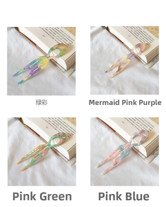 Detailed close-up of marble-textured acetate U-shaped hair pins in four gradient colors