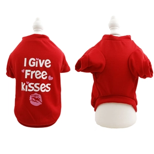 Close-up of red cotton dog t-shirt with I Give Free Kisses slogan and heart pattern
