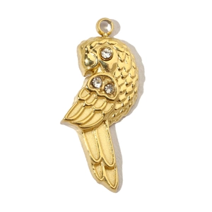 Macro shot of gold parrot pendant with sparkling rhinestones and metal loop detail