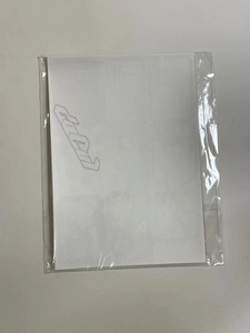 Flat view of Christmas decorative stickers packed in clear plastic bags on a desk