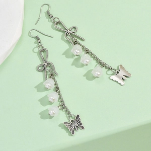 Silver bowknot and lily of the valley tassel earrings with butterfly pendants on green