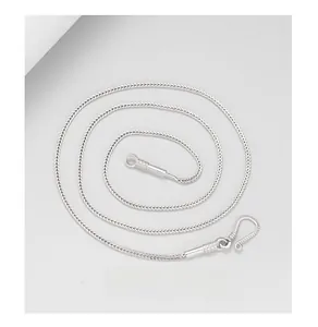 Detail view of silver snake chain necklace with spiral pattern and S-hook clasp