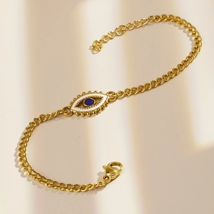 Gold stainless steel evil eye bead bracelet for women featuring blue enamel heart charm