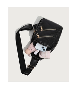 Spacious interior of black pebble leather sling bag showing phone and umbrella storage