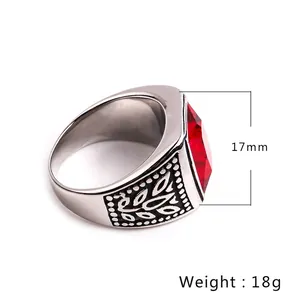 Men's vintage stainless steel ring featuring a large faceted red gemstone and leaf texture