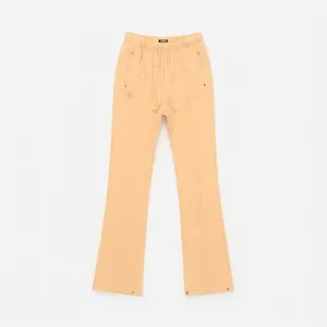 Detail of light apricot flared sweatpants featuring elastic drawstring and cross embroidery