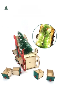 Detail of wooden Christmas sleigh advent calendar with 24 green drawers and LED lights