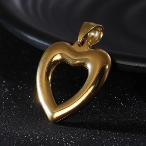 Polished hollow heart pendant necklace in gold titanium steel on black background