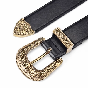 Women's vintage black leather belt featuring ornate gold buckle and metallic accents
