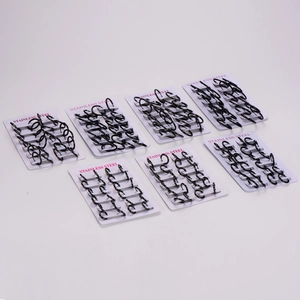Set of multiple size black stainless steel hoop earrings on display card for wholesale
