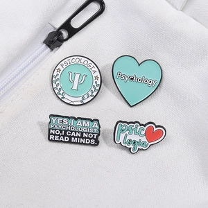 Set of 4 psychology themed enamel pins featuring inspirational quotes on a canvas bag