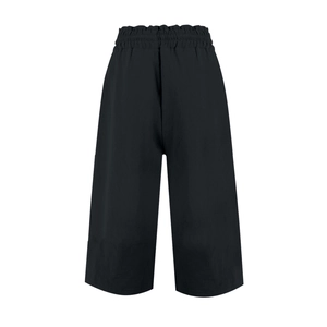 Detail of high waist elastic waistband with drawstring on black linen wide leg trousers