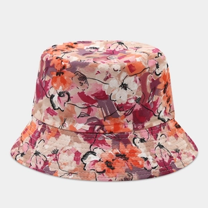 Detail of vibrant floral bucket hat with high-quality reinforced stitching on brim