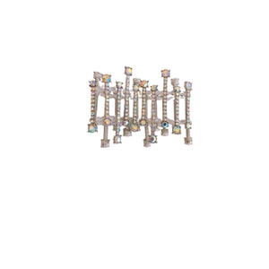 Artistic silver cuff bracelet featuring vertical lines and iridescent rhinestones on white