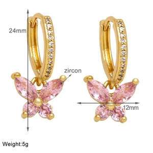 Detailed view of gold butterfly drop earrings with pink zircon and exact dimensions