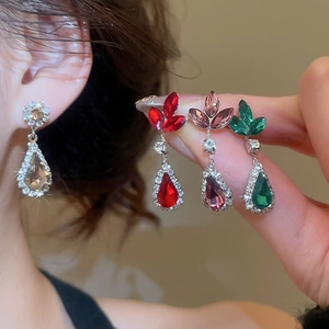 Detailed close-up of water drop rhinestone flower earrings in four elegant colors