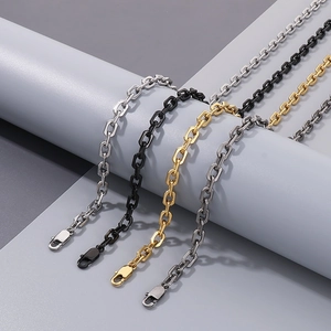 Detail view of O-chain necklace in silver, black, gold and gunmetal with lobster clasp