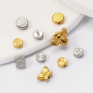 DIY jewelry beads in butterfly bee and heart shapes made of gold and silver stainless steel