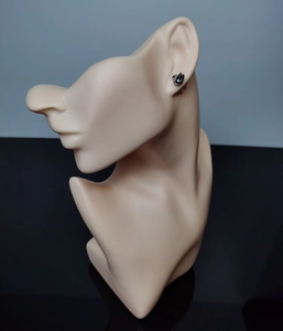 Close-up of black swan stud earrings with micro crystals on a mannequin head model