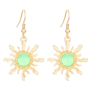 Bohemian gold sun-shaped earrings with green round gemstones on a clean white background
