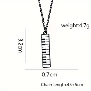 Piano keyboard pendant necklace with musical note charm and size measurement details