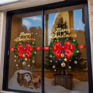 Christmas window decals featuring red bows, pine wreaths, and golden Merry Christmas text
