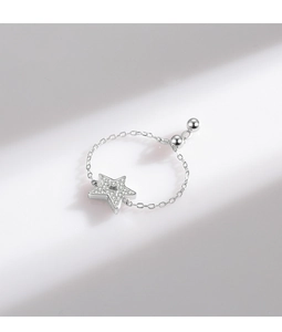 Close-up of adjustable S925 silver star ring with micro-set zircon on white background