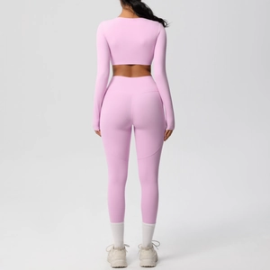 Detail view of pink high-waisted yoga pants with curved back stitching for butt-lifting